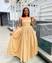 Peach sleeveless maxi dress with square neckline and pleated full skirt