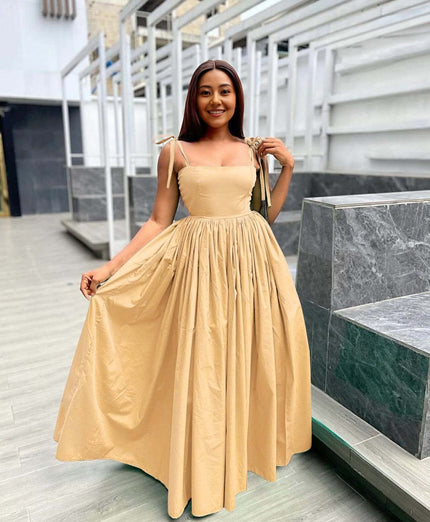 Peach sleeveless maxi dress with square neckline and pleated full skirt