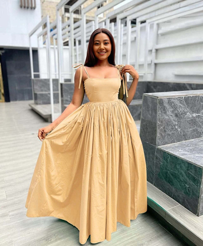 Peach sleeveless maxi dress with square neckline and pleated full skirt