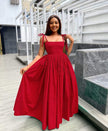 Red sleeveless maxi dress with square neckline and pleated voluminous skirt