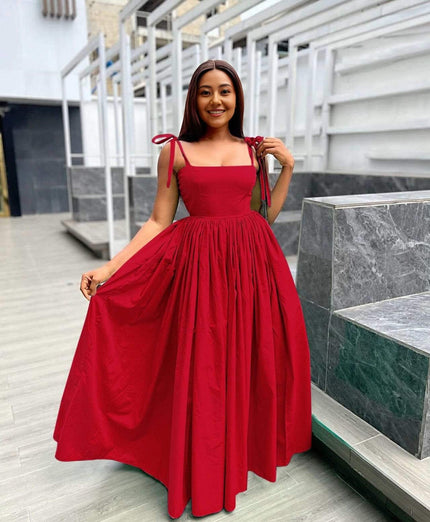 Red sleeveless maxi dress with square neckline and pleated voluminous skirt
