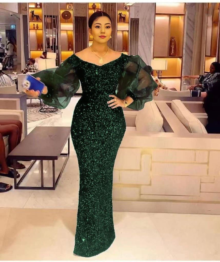 Dark-green sequin maxi dress with puff sleeves, fitted mermaid silhouette