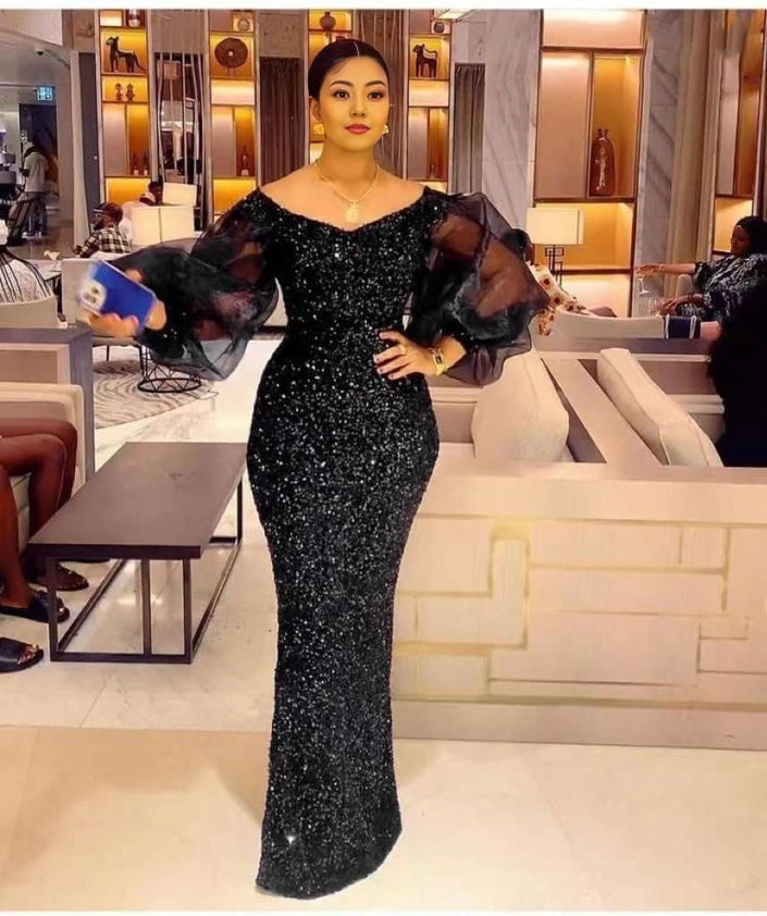 Black sequin maxi dress with puff sleeves, fitted mermaid silhouette