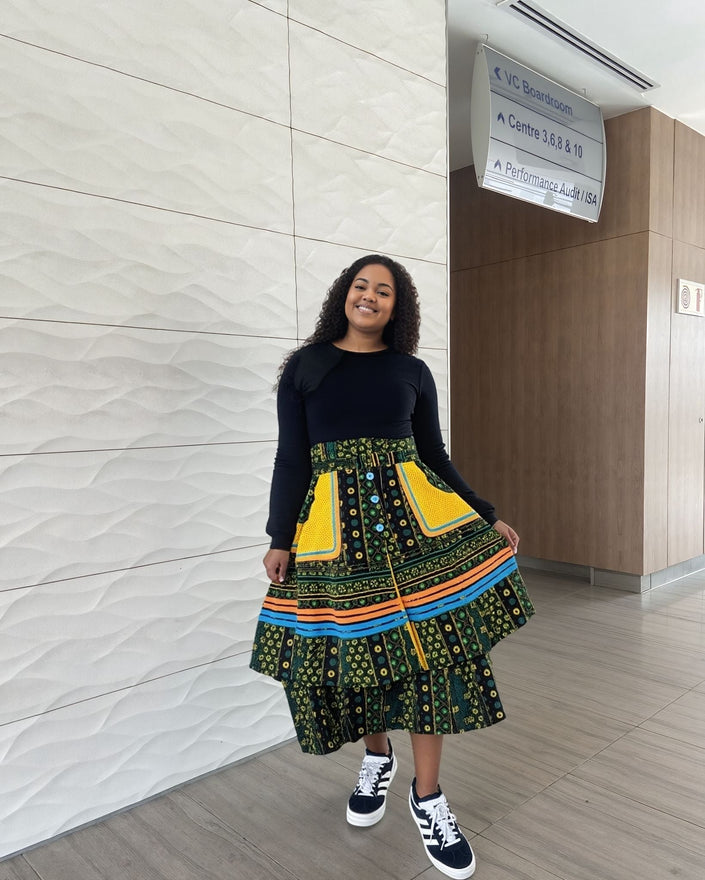 Green A-line printed skirt with colorful border, adjustable waistband