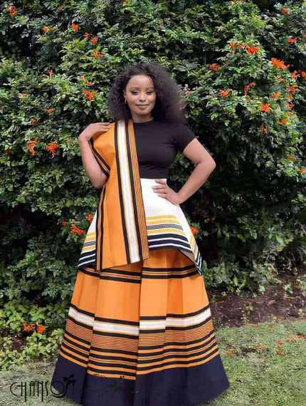 African maxi skirt set with black fitted top and orange striped flared maxi skirt