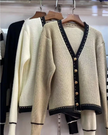 Khaki knit V-neck cardigan with black trim and button front, long sleeves
