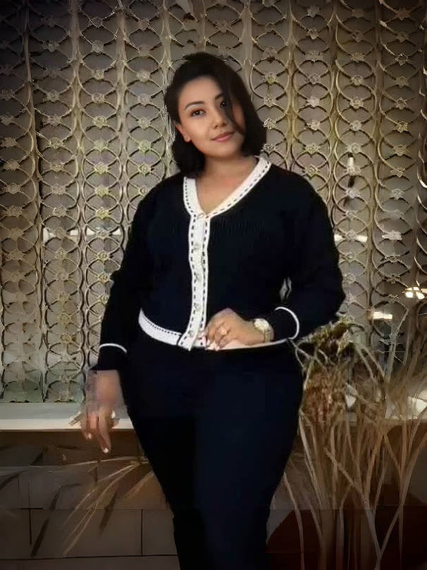 Dark navy knit V-neck cardigan with white trim and button front, long sleeves