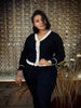 Dark navy knit V-neck cardigan with white trim and button front, long sleeves
