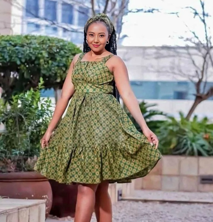 Green printed A-line circle dress, sleeveless with gathered ruffle hem