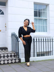 Black V-neck crop top and wide-leg pants twin set, ruched front, long sleeves