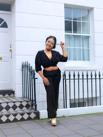 Black V-neck long-sleeve crop top and wide-leg pants set