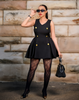 Black sleeveless mini dress with gold button detailing and V-neck