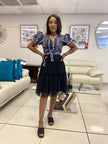 Geometric puff-sleeve skirt in navy with white patterned bodice and tiered tulle hem