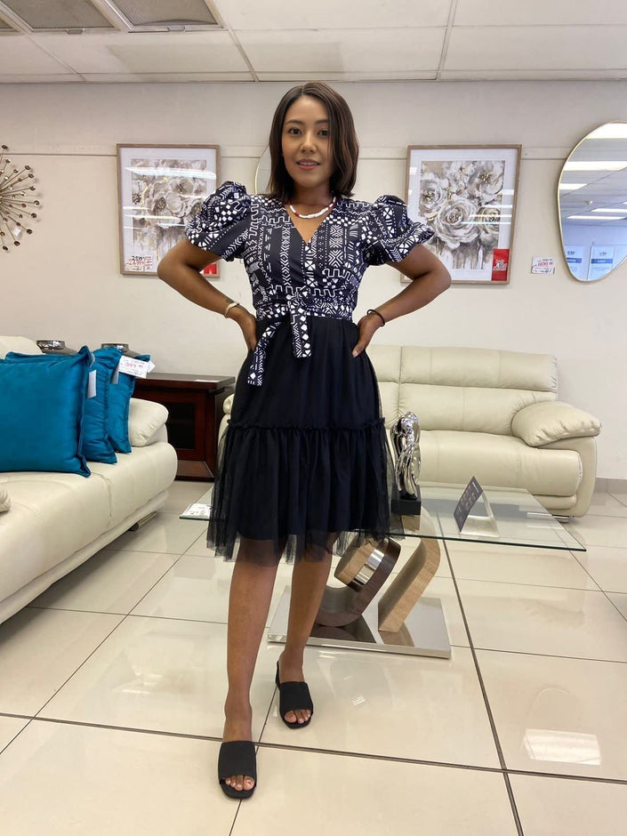 Geometric puff-sleeve skirt in navy with white patterned bodice and tiered tulle hem