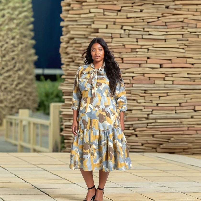 Tiered Abstract Print Midi Dress with Bow Tie Neck and Long Sleeves
