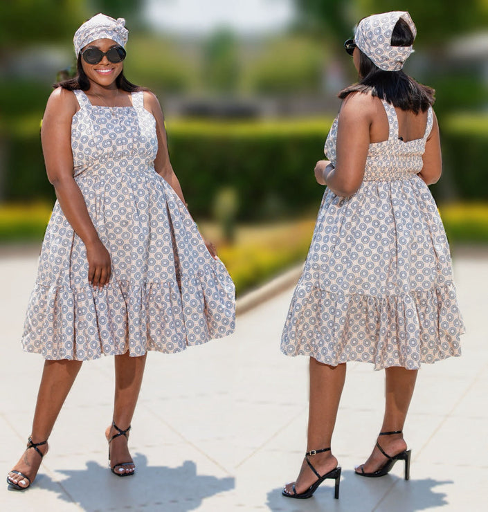 Sleeveless midi dress with blue geometric print and flared skirt, front and back views