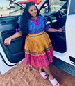 African print puff-sleeve top with pleated skirt, yellow and magenta striped pattern set