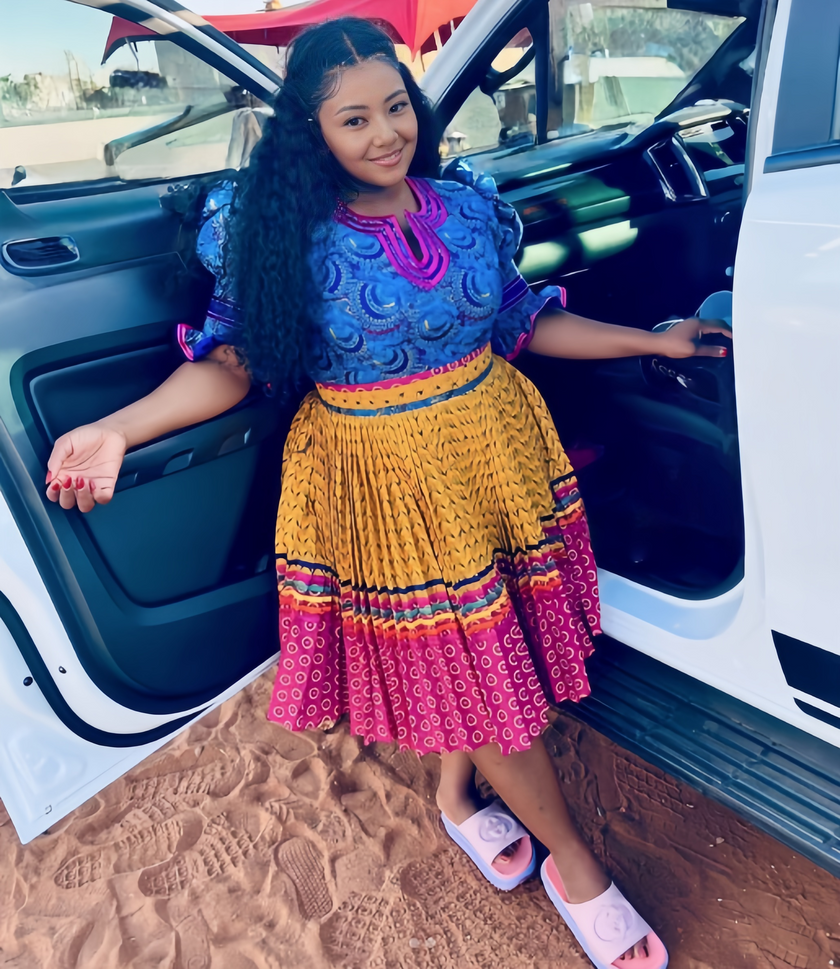 African print puff-sleeve top with pleated skirt, yellow and magenta striped pattern set
