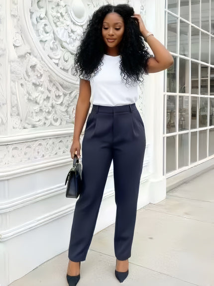 High-waist tailored dark navy pants with tapered ankle fit, belt loops, and front creases