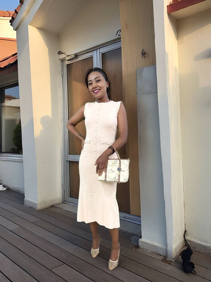 White knitted midi dress with vertical button placket and fitted sleeveless bodice