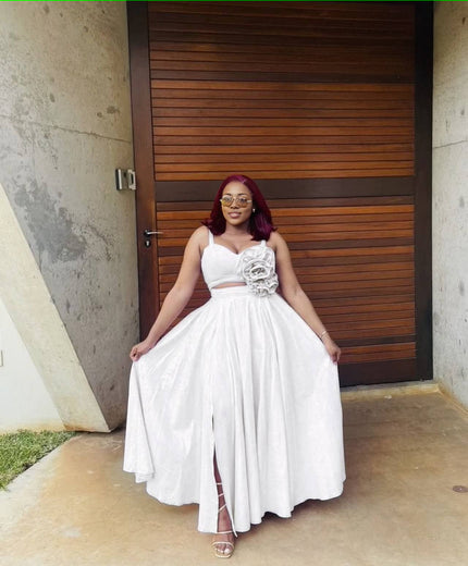 White maxi dress with floral waist applique, sleeveless sweetheart bodice, slit hem