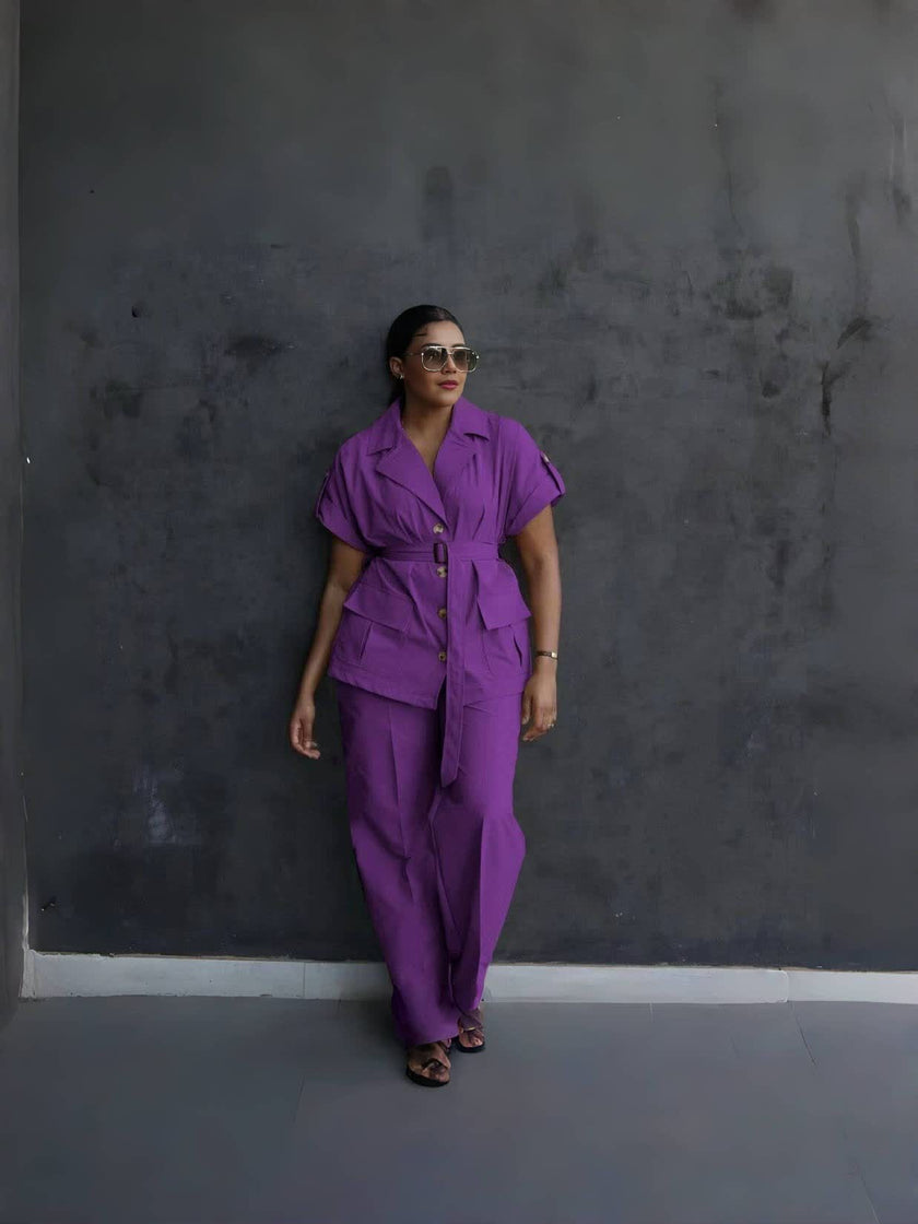 Purple belted lapel pantsuit with button-front short-sleeve jacket and loose matching trousers