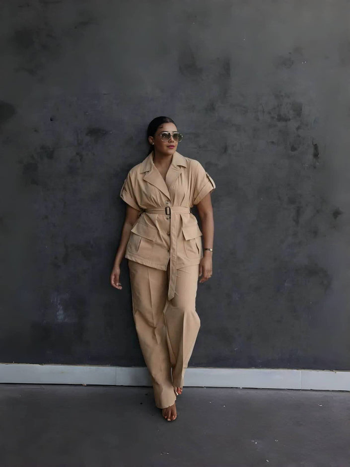 Nude belted lapel pantsuit set with button-front jacket and matching loose trousers