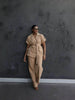 Nude belted lapel pantsuit set with button-front jacket and matching loose trousers