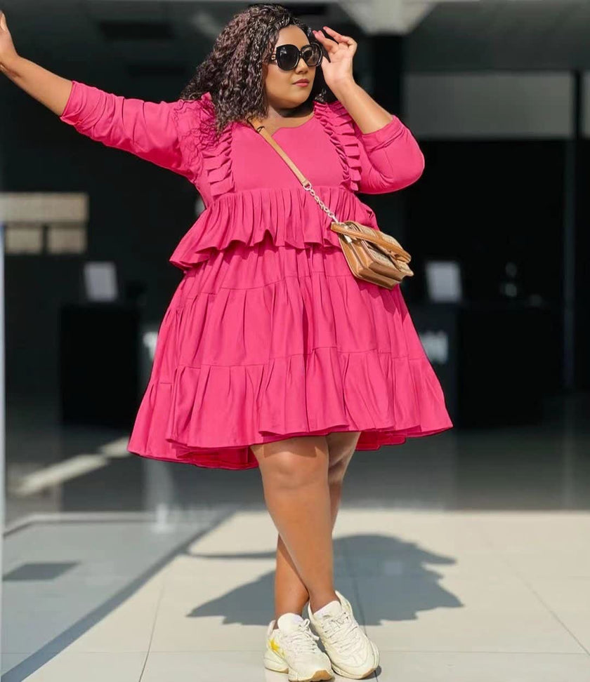 Tiered mini dress in hot pink, long sleeves, ruffle layers, gathered bodice