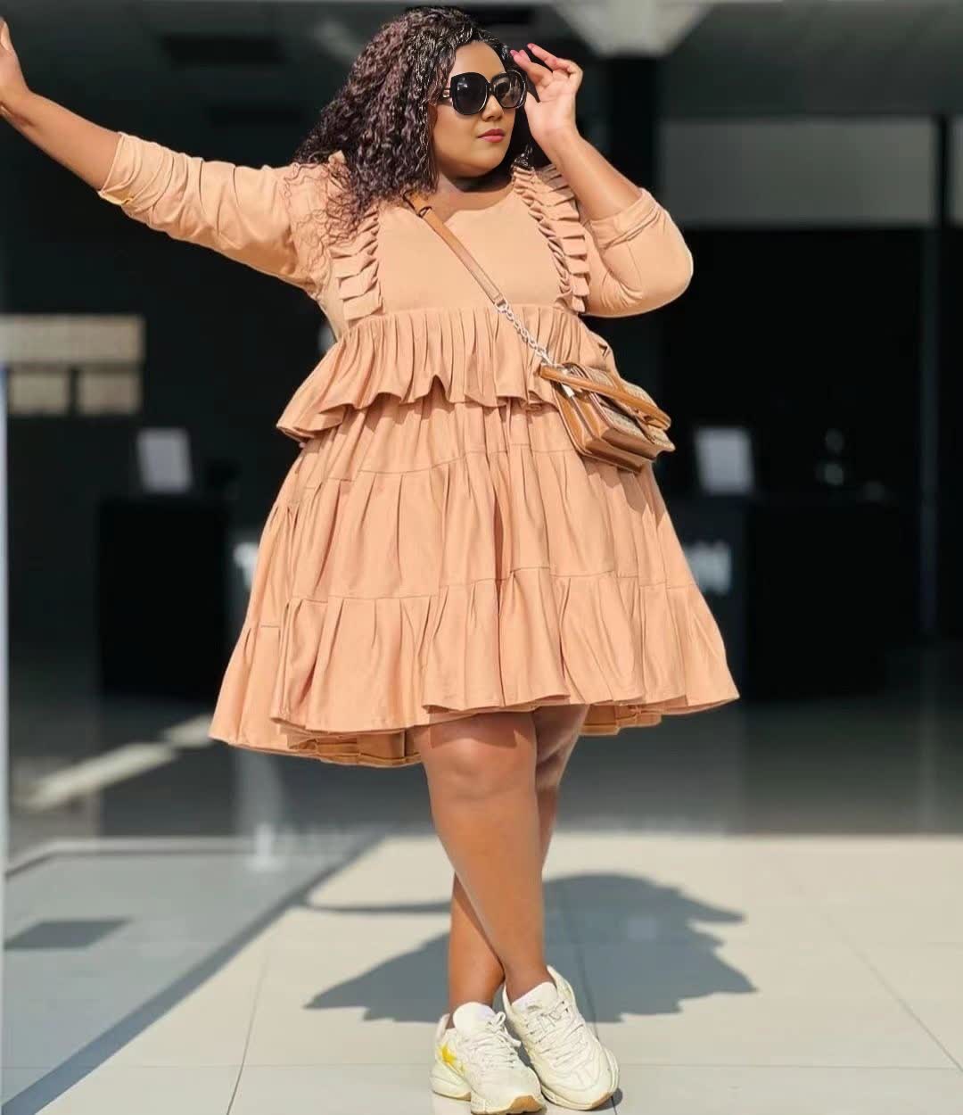 Tiered mini dress in peach, long sleeves, ruffle layers, gathered bodice