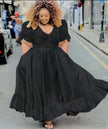 Black puff-sleeve midi dress with V neckline and ruffle hem, full gathered skirt