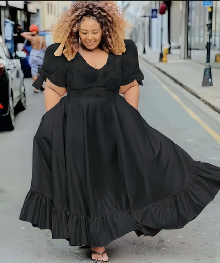 Black puff-sleeve midi dress with V neckline and ruffle hem, full gathered skirt
