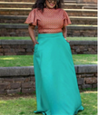 Two-piece geometric ruffle top and turquoise flared maxi skirt with elastic waist