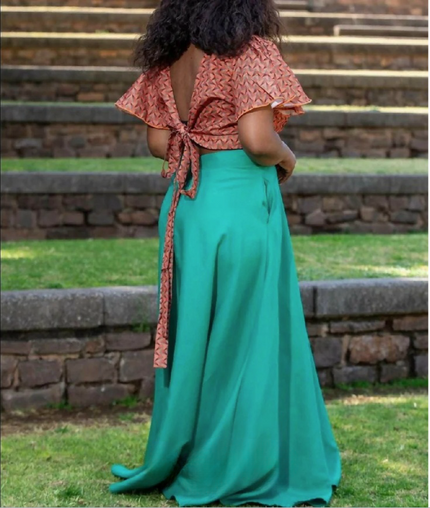 Two-piece geometric ruffle top with back tie and turquoise flared maxi skirt