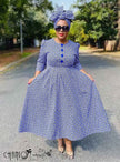 African print midi dress, blue geometric pattern, round neck, button-front, flared skirt