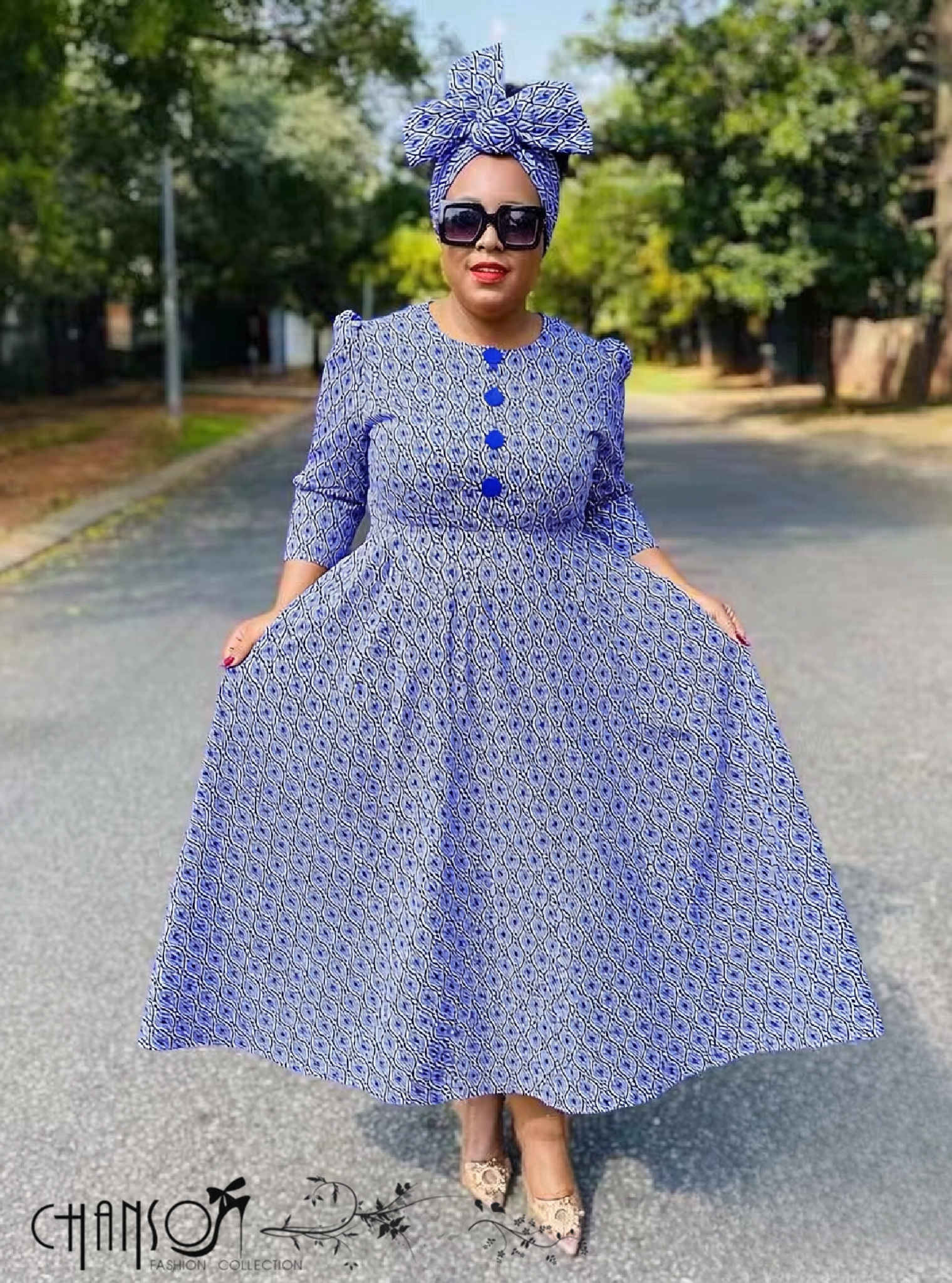 African print midi dress, blue geometric pattern, round neck, button-front, flared skirt