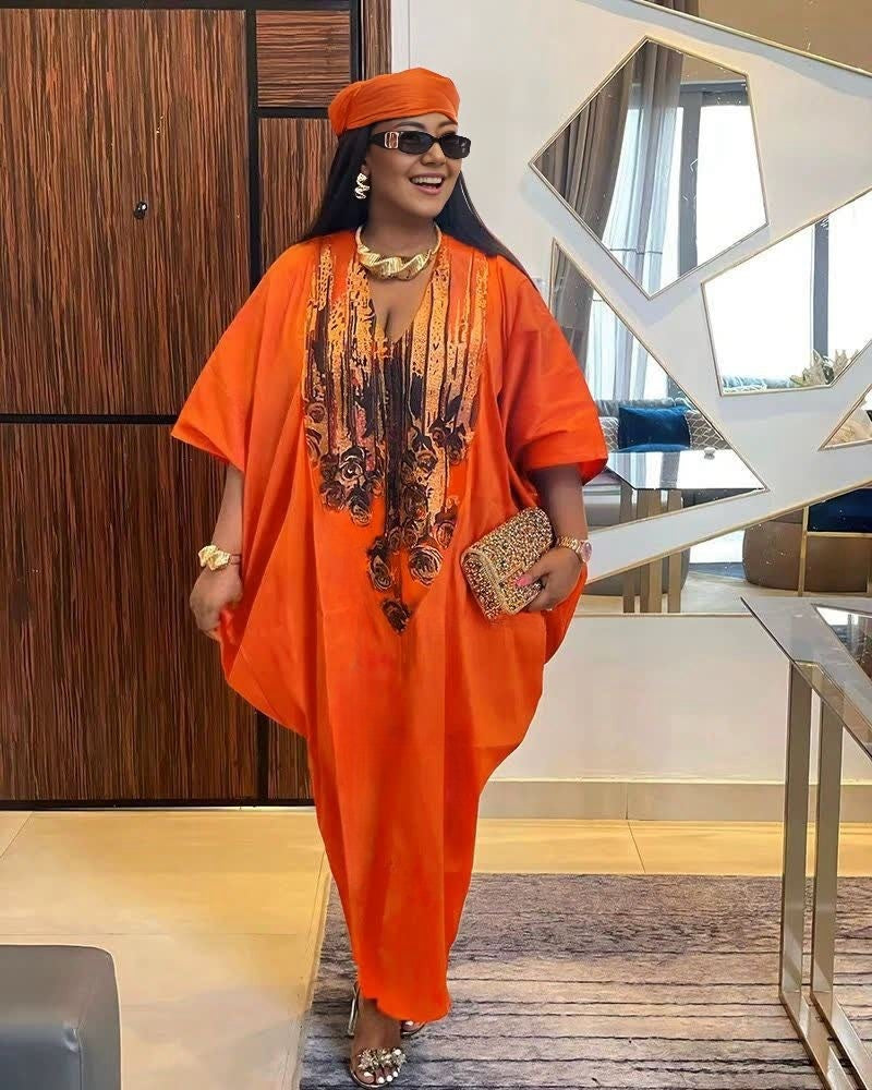 Plus size kaftan dress in orange-red with V-neck and gold floral-pattern print
