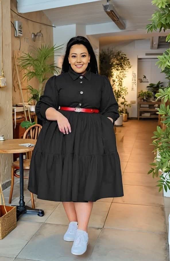 Black tiered midi dress with red belt, long sleeves, buttoned front and rounded collar