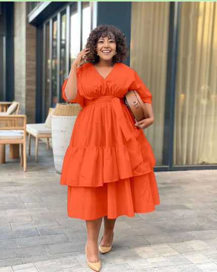 Orange-red tiered midi dress with puff sleeves and V-neck, gathered waist