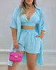 Light blue three-piece set with V-neck crop top, drawstring shorts, open button shirt