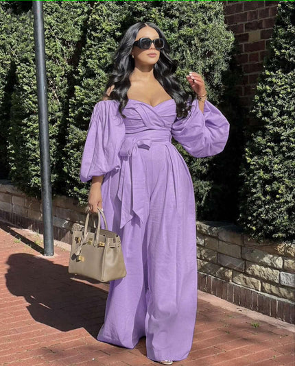 Light-purple off-shoulder jumpsuit with puff sleeves, ruched bodice, and wide-leg pants