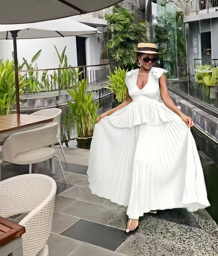 White tiered maxi dress with puff sleeves, ruffled bodice and V-neck