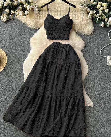 Black smocked camisole crop top and pleated maxi skirt set