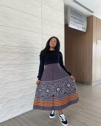 Printed high-waist skirt with navy, white medallions and orange striped border