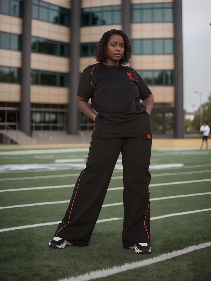 Black wide-leg pants with stretch waist and red side piping
