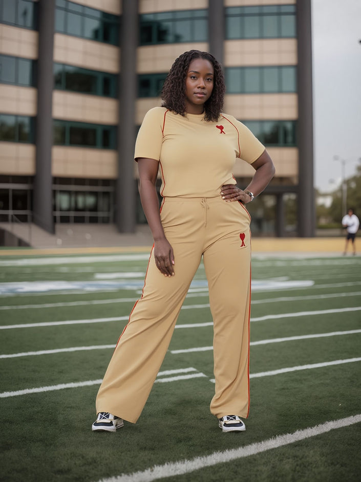 Tan wide-leg pants with stretch waist and red side piping