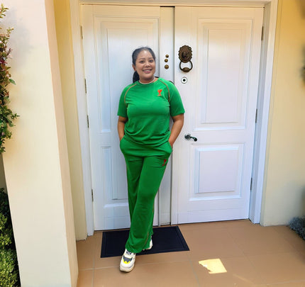 Green wide-leg pants with stretch waist and small chest logo
