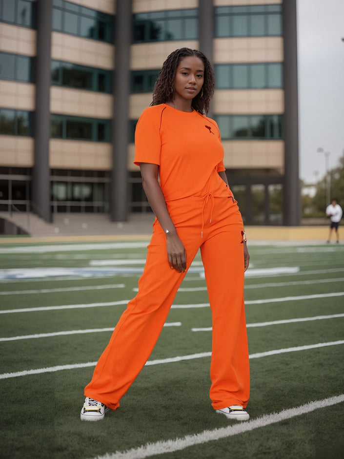 Orange-red wide-leg pants with stretch waist and drawstring