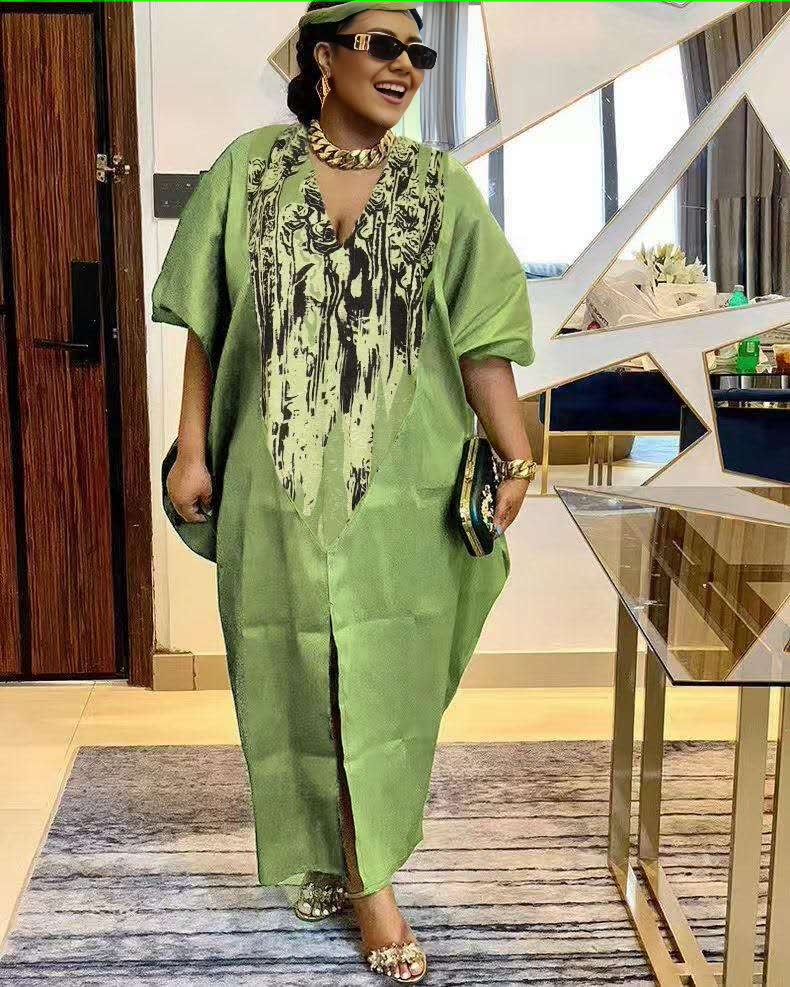 Plus size kaftan dress in green with V-neck and black floral-pattern panel