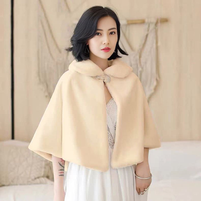 Cream cape with bow clasp, short sleeves, high collar